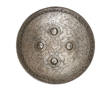 A 19th century Indian shield dhal, lightly chiselled on the outer panel with antelope, boar, elephants, oxen, tigers, a hunts