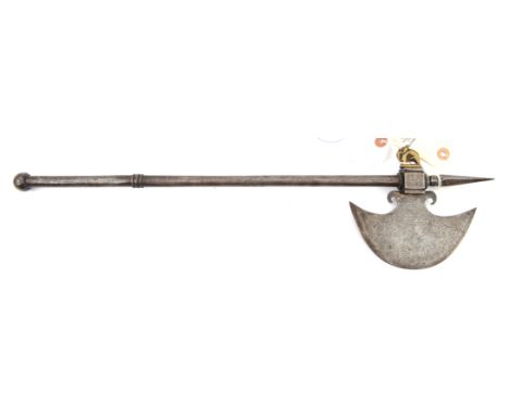 A small Indian axe,  swollen crescent shaped blade 5½”, with faint traces of decoration, into square head with screw in brass