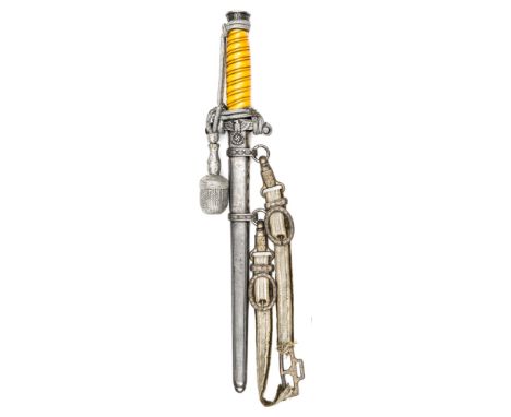 A Third Reich Army officer’s dagger, with unmarked blade and silver plated hilt with dark yellow grip, in its sheath with han