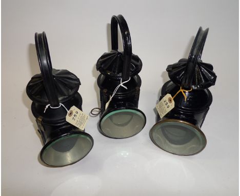 3 S[E]R/LNER Railway hand lamps. 2x S[E]R black painted lamps, one marked ‘T.E. Bladon & Son Ltd. 1939’ and another LNER exam