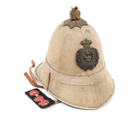 A rare sealed pattern khaki tropical helmet brass acanthus plume mount with Victorian crowned general service brass badge, in