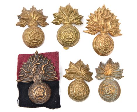 3 R Fusiliers cap badges:  large Vic, small Vic with slide and pair collars, blackened KC and single brass collar. GC (6)    