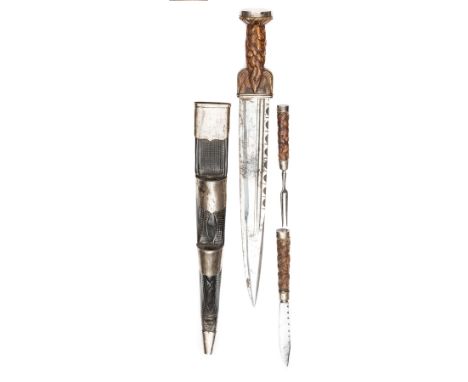 A Highland dirk, blade 10” with line, back fuller and scalloped back edge, brown stained grip of traditional form, plain silv