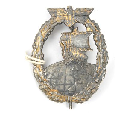A Third Reich Auxiliary Cruiser badge,  solid back integrally cast with “JMME-SOHN BERLIN”, with round pin. Basically GC (wor
