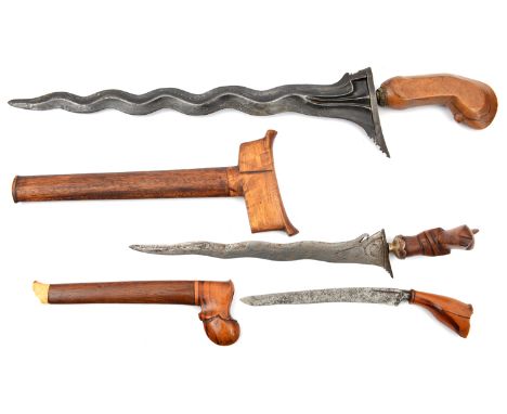 A kris, deepy fullered wavy blade 15”, small cap to facetted grip (worn) no scabbard; another small kris, in sheath (AF); a b