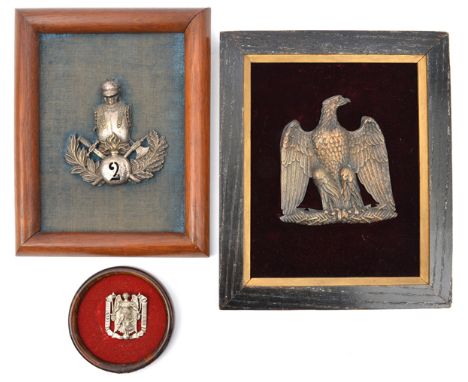 2 19th cent French badges: large brass eagle on twisted bar and lightning, 6” x 5½” and plated helmet and breastplate, on gre