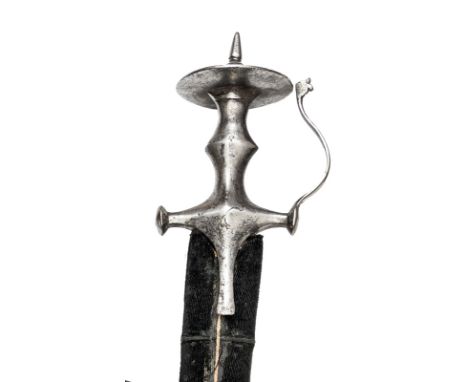 An 18th century tulwar hilted Indian sword, very slightly curved broad blade 33”, with narrow back fuller and double edged at