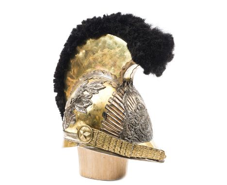 A Hanoverian cavalry officer’s gilt helmet, c 1825, the skull with applied acanthus leaves to the back, the front peak with b