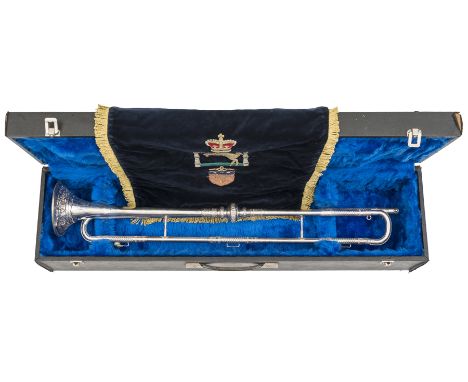 A silver plated ceremonial military trumpet, embellished with panelled spiral bands, the muzzle and central knop embossed wit