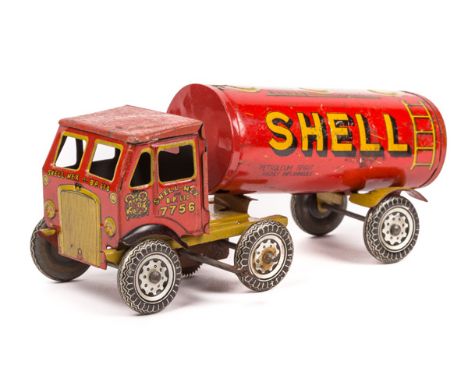 A Wells Brimtoy tinplate clockwork Albion style Shell-BP articulated petrol tanker. In red and yellow livery, with Shell Mex 