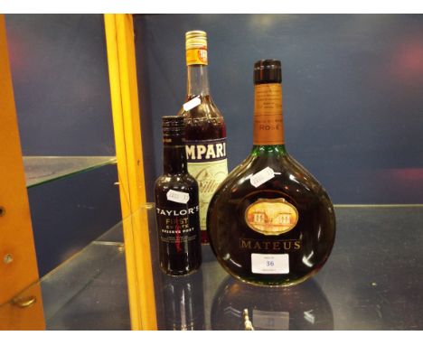A bottle of Mateus Vinho de Mesa rose, 20cl bottle of Taylor's First Estate reserve port and a bottle of Campari