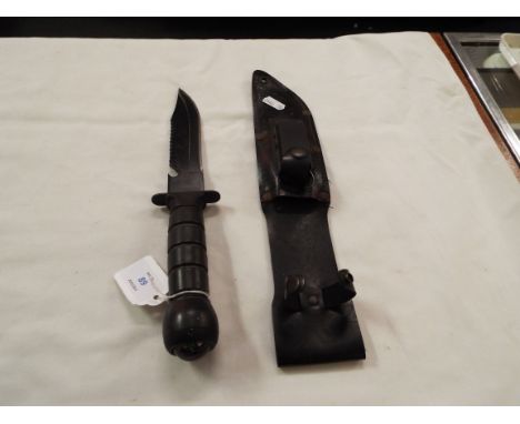 A diving knife with compass to hilt
