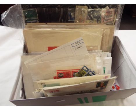 A quantity of assorted stamps to include first day covers, loose, unused etc