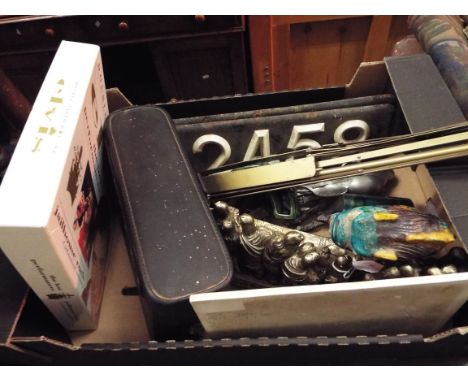 A box of assorted to include pottery fish, vintage number plates, brass music stand, painted tile, etc