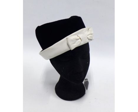 CHRISTIAN DIOR, vintage hat in black velvet with white leather band and bow, labelled Christian Dior Chapeaux 