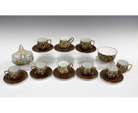 An early 20th century handpainted set of  Czechoslovakia cups and saucers with a matching sugar bowl and an English handpaint