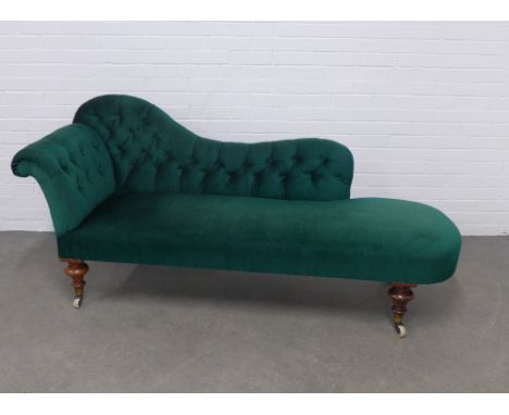 Green buttonback upholstered chaise-lounge, on mahogany legs with ceramic castors,  196 x 88 x 66cm. 