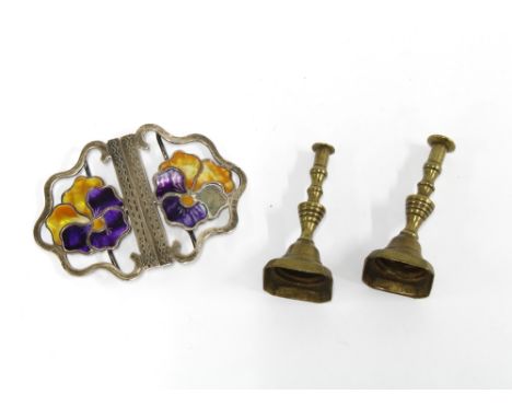 Edwardian silver and enamel belt buckle, Birmingham 1909 (a/f) and a pair of miniature brass candlesticks (3) 