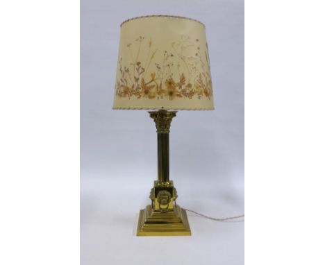 Brass Corinthian column table lamp with lion mask heads, complete with shade 