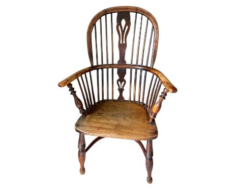 Early 19th century ash and yewwood Windsor chair, with saddle seat and crinoline stretcherGood solid condition with a nice co