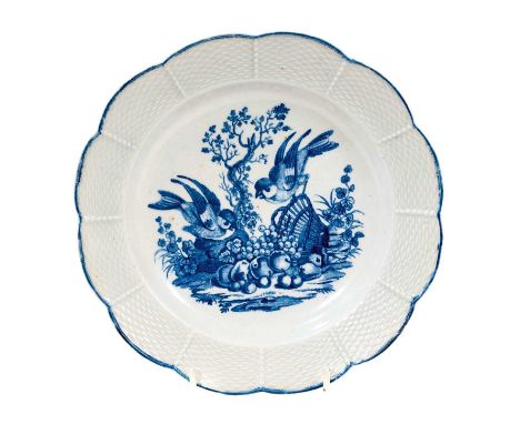 A very rare Worcester plate with shaped basketweave-moulded rim, circa 1765-70, printed in blue with Hancock's 'The Birds on 