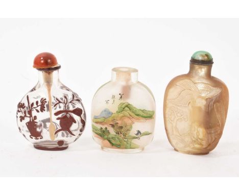 Three Chinese snuff bottles, including carved abalone snuff with jadeite stopper, 7cm high, carved Peking glass snuff and an 