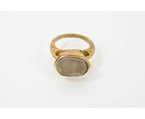 Renaissance style gilt metal ring, the hardstone intaglio depicting a horse, cast setting, pierced shoulders on tapered shank