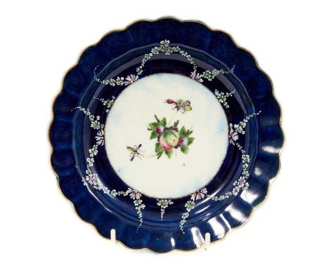 An unusual Worcester scalloped plate, circa 1770, the centre enamelled with spotted fruit and two insects, with raised swag d