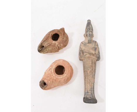 Group of antiquities, including an Egyptian Ushabti, 21cm long, and two Roman oil lamps
