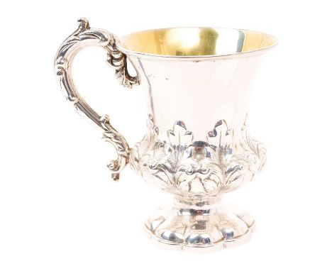 Victorian silver christening mug of campana form, with silver gilt interior, embossed foliate decoration and decorative scrol