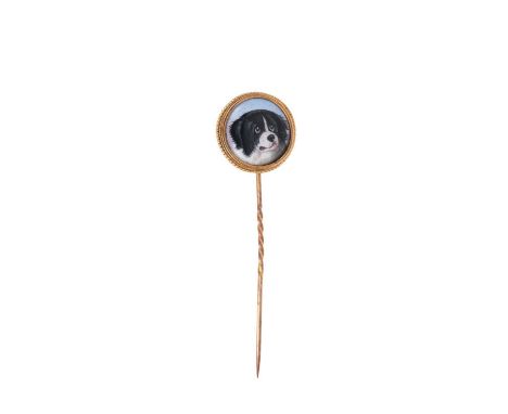 A 19th century gold and enamel stick pin, the circular polychrome enamel plaque finely painted with a portrait of a dog, in g