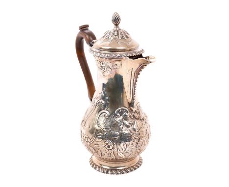 George III silver coffee pot of baluster form, with later chased decoration, hinged cover with flame finial and fruitwood han