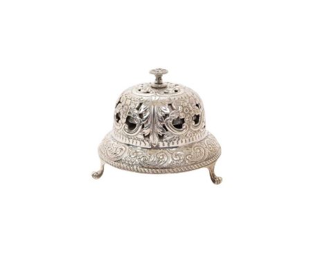 Late Victorian silver table bell of domed form, with twist ringing mechanism and pierced foliate decoration, on three paw fee