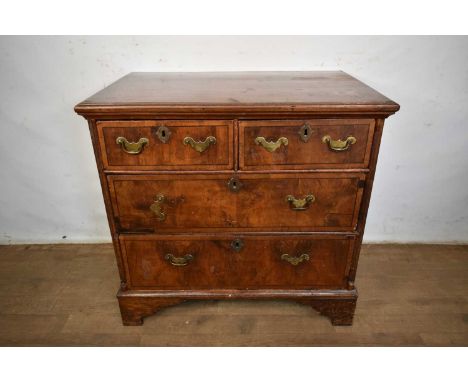 Early 18th century walnut chest of two short and two long drawers on bracket feet, 86cm wide x 57cm deep x 84cm highStaining 