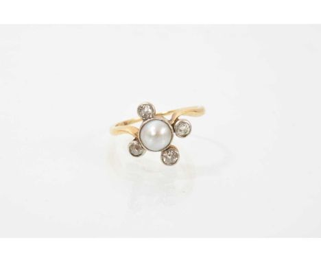 Edwardian pearl and diamond ring with a central half pearl measuring approximately 6.5mm diameter, with four old cut diamonds