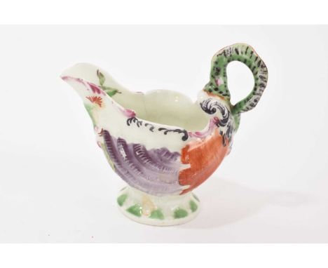 A Worcester ‘dolphin ewer’ cream boat, circa 1765, shell-moulded and polychrome decorated, 8.25cm highHairline on one side. O