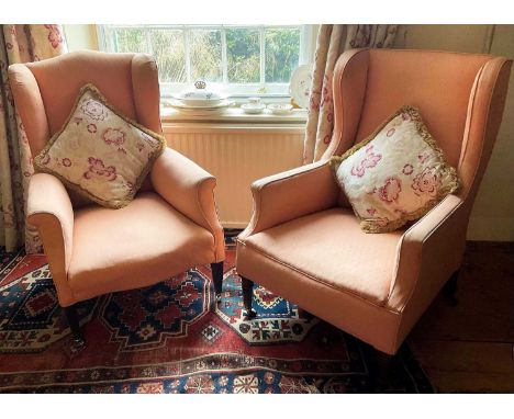 19th century salmon pink upholstered wing armchair on turned legs, and another similar chair on square tapered legs and casto