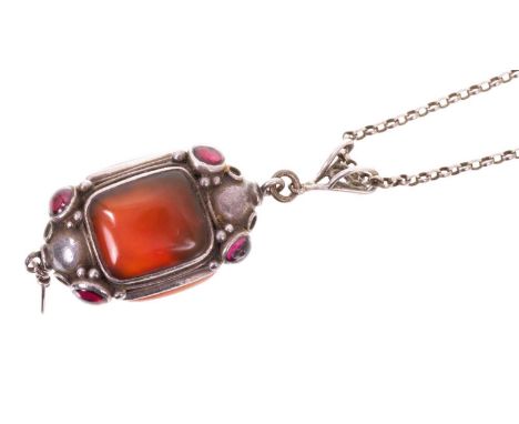Arts &amp; Crafts silver pendant with cabochon garnets and carnelian panels, on a later silver belcher link chain, the pendan