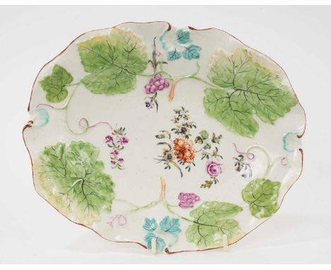 A Derby leaf moulded oval dish, circa 1758, polychrome painted with floral sprays, with red-lined rim, 27cm wideProvenance: W