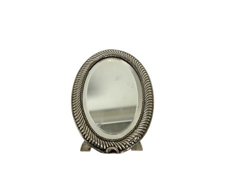 Victorian silver oval framed mirror, with wrythen decoration, bevelled plate and easel back (marks rubbed) William Comyns. 17