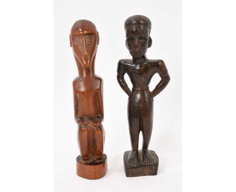 Two African carved wood figures, one in reddish wood and in the style of the 'Baboon Master', the other with carved pattern t
