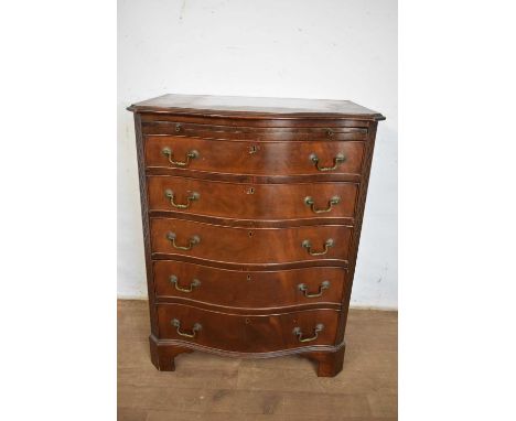 Chippendale style mahogany serpentine chest of drawers, with brushing slide and five graduated drawers between blind fret ang