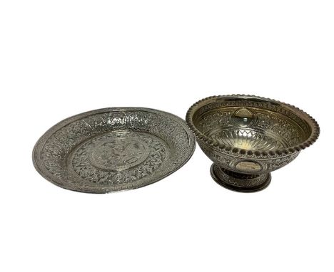 Late 19th/early 20th century Burmese silver dish of circular form, with flared rim and embossed decoration (apparently unmark