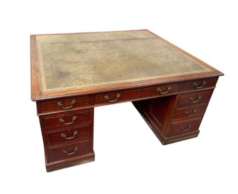 Victorian style mahogany partners' desk, of unusually deep form, with inset tooled leather top and nine drawers to each kneeh