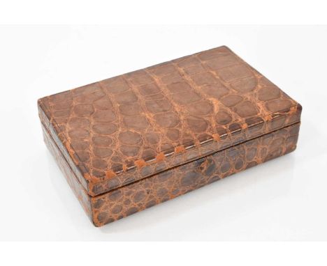 Edwardian crocodile leather jewellery box with green velvet lined interior, 14cm x 9cm x 4cm.