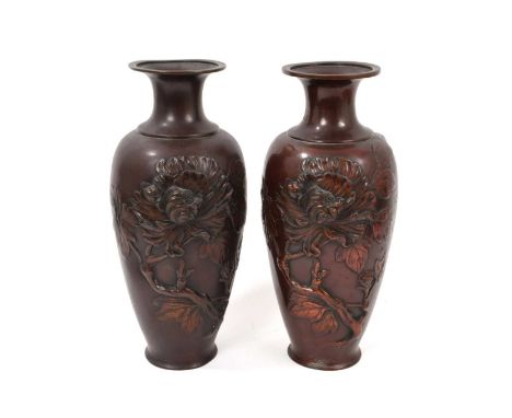 Matched pair of Japanese bronze vases, of baluster form, with raised chrysanthemum ornament, 30cm highSome surface wear and a