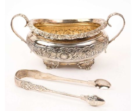 Georgian silver twin handled sugar bowl of compressed baluster form, with embossed floral decoration, on four paw feet (marks