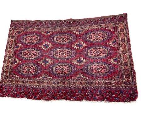 Antique Tekke rug, with three rows of three medallions in geometric borders, 132 x 82cm
