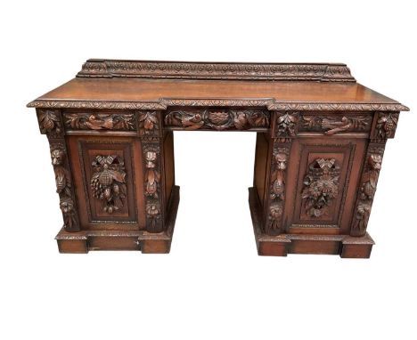 19th century Flemish heavily carved oak pedestal sideboard, of inverted breakfront outline, with rear gallery and three friez