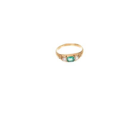 Victorian emerald and diamond three stone ring with a central emerald flanked by two old cut diamonds in gold setting with ca